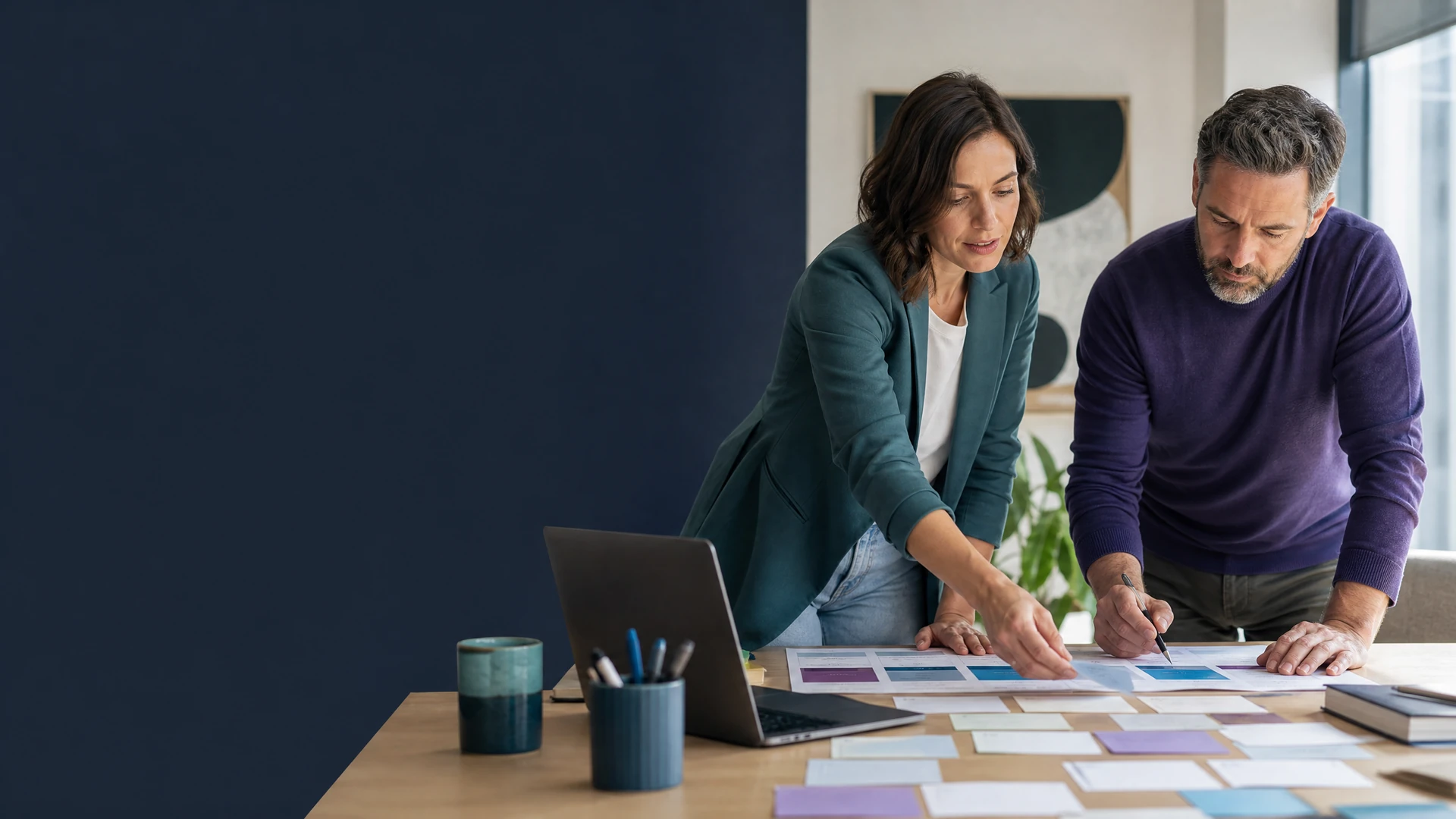 Content strategist and business owner organizing a content plan together.